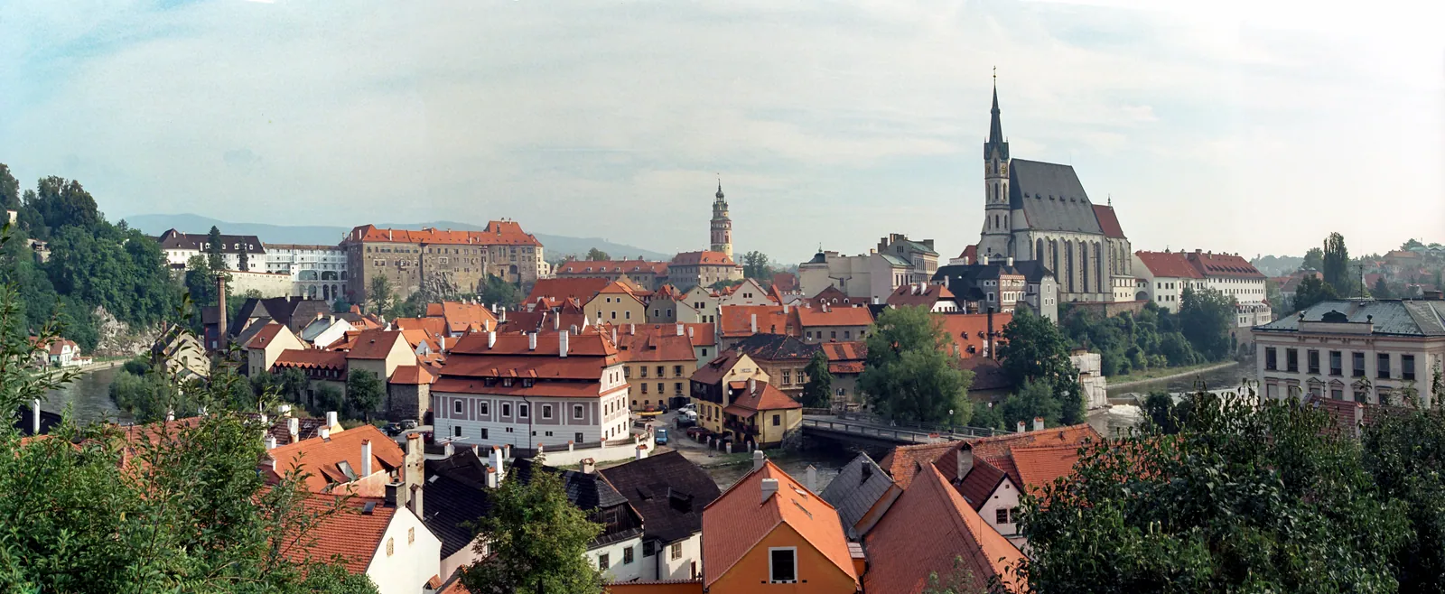 Terracotta rooftops and the winding Vltava beneath the castle in Český Krumlov.